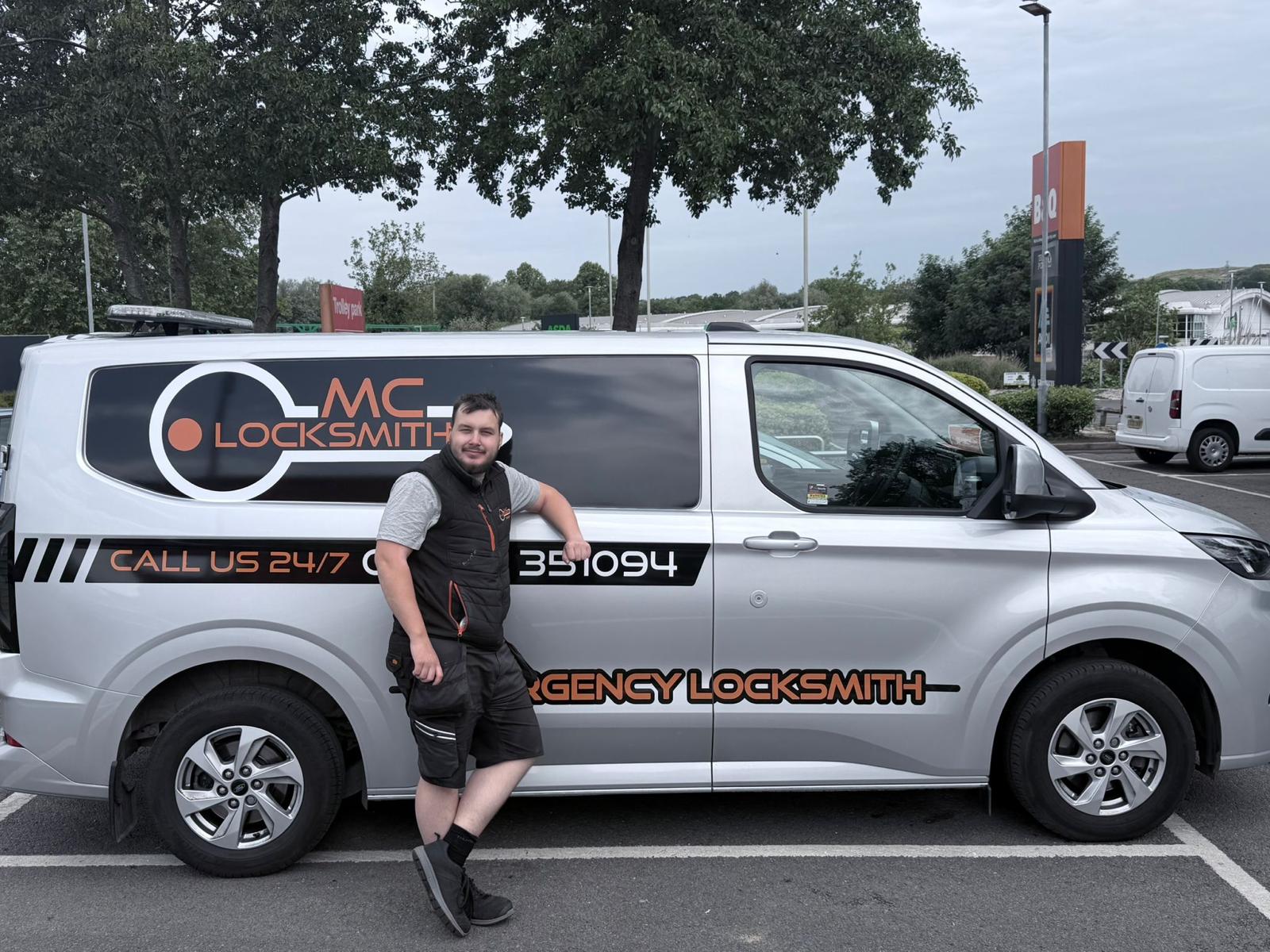 Morgan beside the MC Locksmiths service van